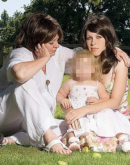 Rape victim: Elizabeth Cameron with her daughter Phoebe (her face obscured at Elizabeth's request) and mother Sarah